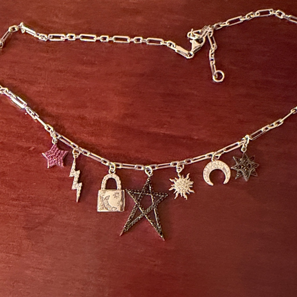Sterling silver charm necklace.